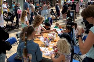 Summer High Street Event, week 4. Children drawing on the face masks.