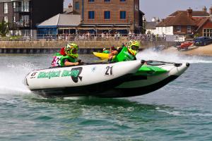 Littlehampton Waterfront Festival. A speed boat racing in the marina.