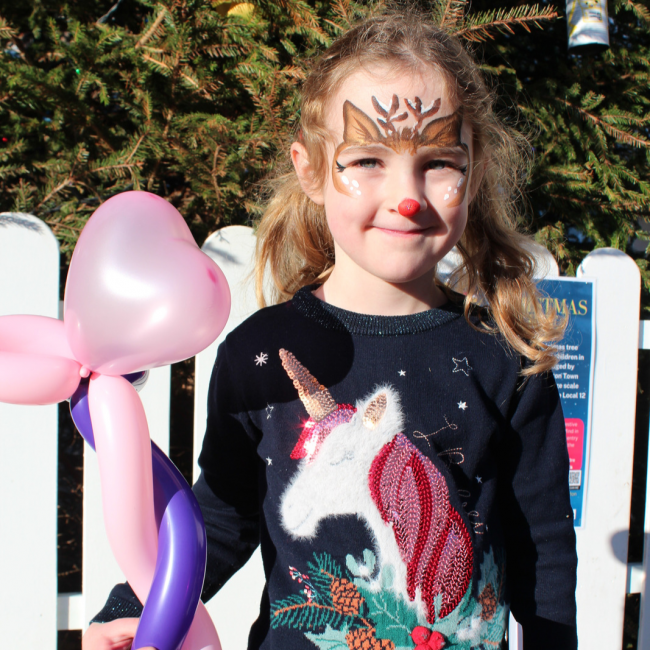 A girl at the Love Local Christmas Fun Day event