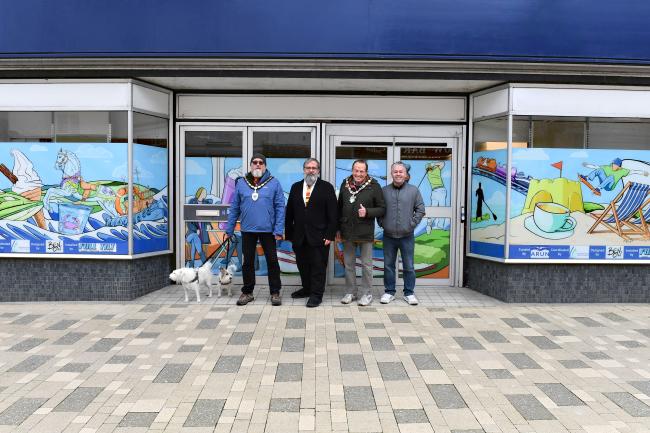 Shop window wraps 2024 councillor Sean Lee, Alan Butcher, Dr Walsh and Ben Cavanagh standing outside shop
