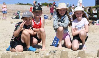 Littlehampton Sandcastle competition 2024. Children making sand sculptures.