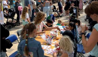 Summer High Street Event, week 4. Children drawing on the face masks.